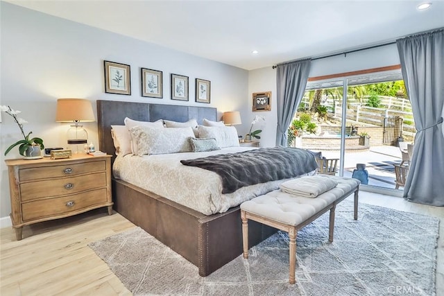 bedroom featuring access to outside and light hardwood / wood-style floors