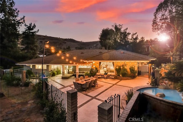 patio terrace at dusk with an outdoor hangout area