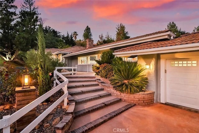 view of front of property with a garage