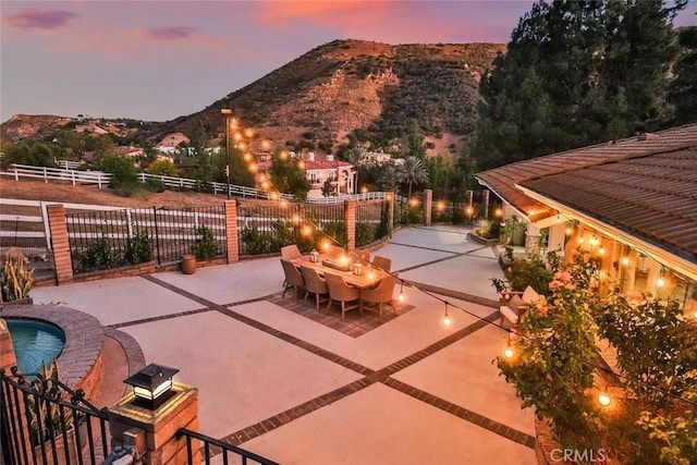 patio terrace at dusk with a mountain view