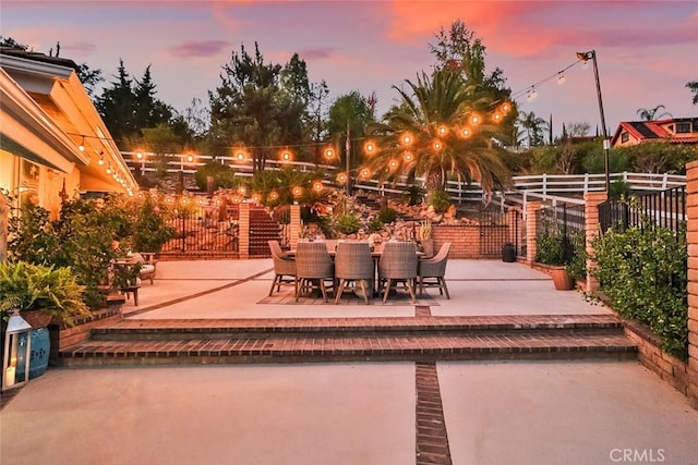 view of patio terrace at dusk