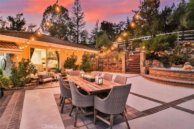 view of patio terrace at dusk