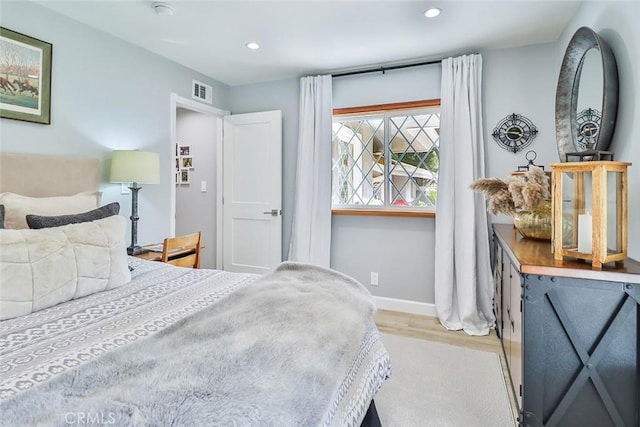 bedroom featuring light hardwood / wood-style floors