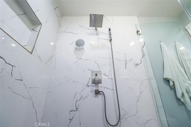 bathroom with a tile shower