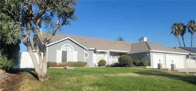 single story home with a front lawn and a garage