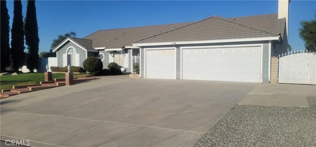 ranch-style home featuring a garage