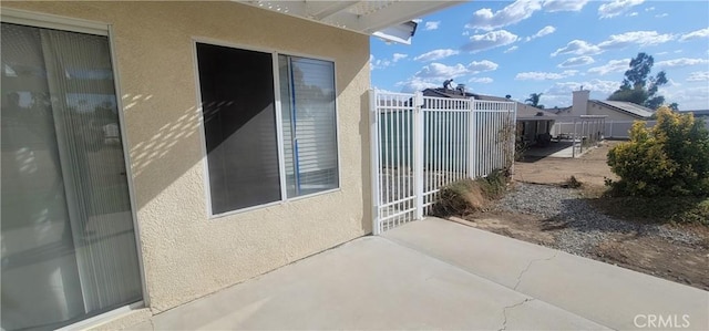 view of side of property featuring a patio