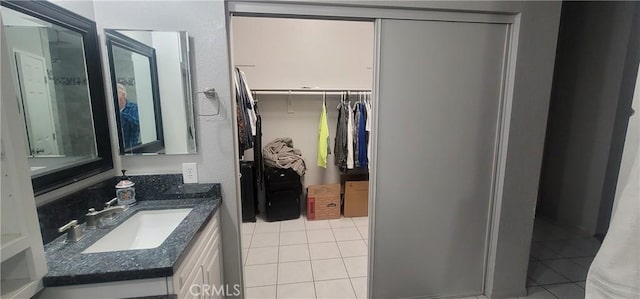 bathroom featuring tile patterned floors and vanity