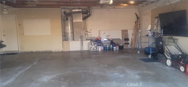 garage with a garage door opener and secured water heater