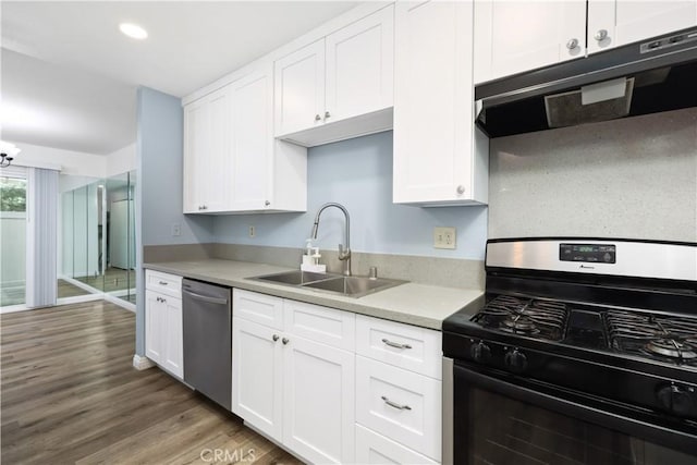 kitchen with dark hardwood / wood-style flooring, white cabinetry, sink, and stainless steel appliances