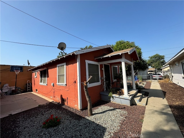 view of property exterior featuring a patio