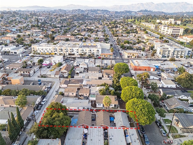 birds eye view of property with a mountain view