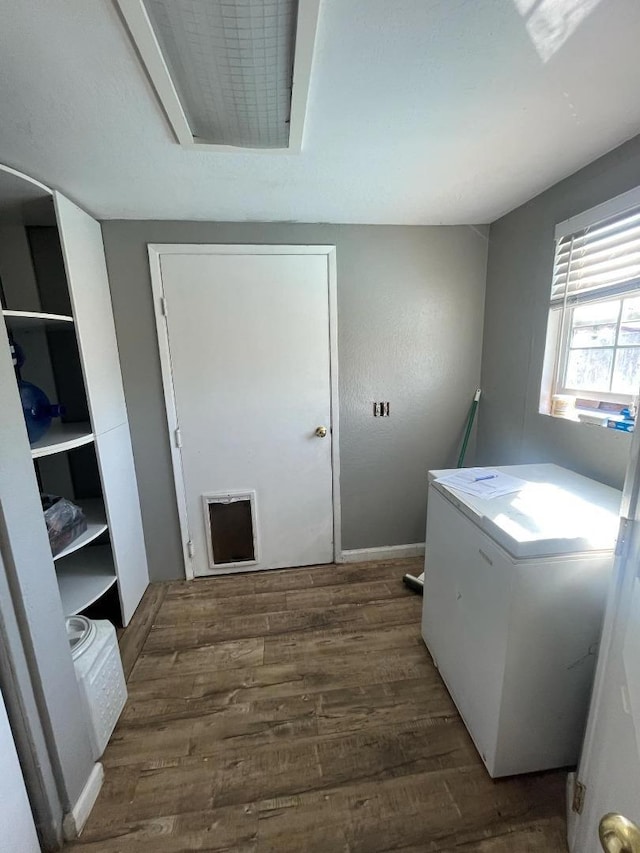 laundry room featuring dark wood-type flooring