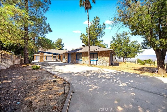 single story home featuring a garage