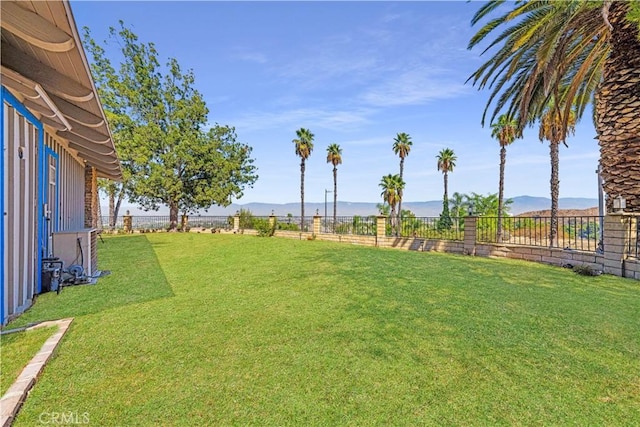 view of yard with a water and mountain view