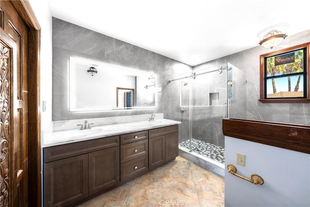 bathroom featuring tile walls, a shower with shower door, and vanity