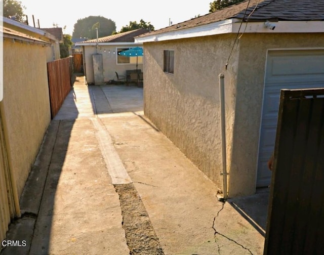 view of property exterior featuring a patio area