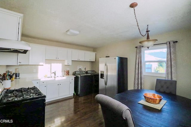 kitchen with white cabinetry, stainless steel fridge with ice dispenser, dark hardwood / wood-style floors, washer and clothes dryer, and black range