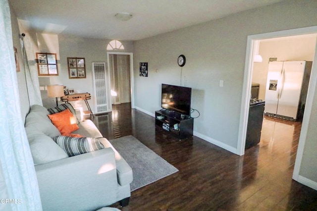 living room featuring dark hardwood / wood-style flooring