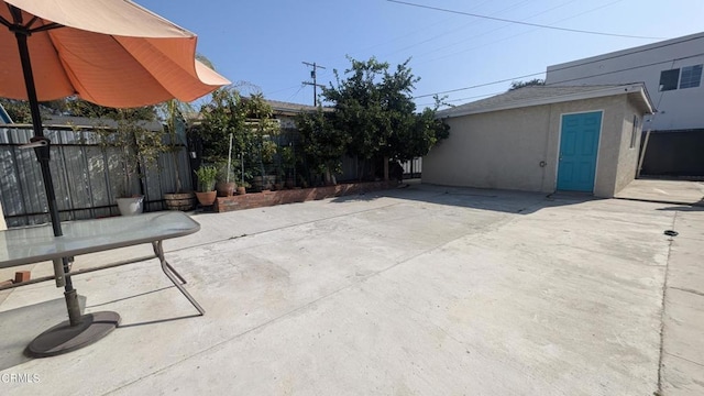 view of patio with an outdoor structure