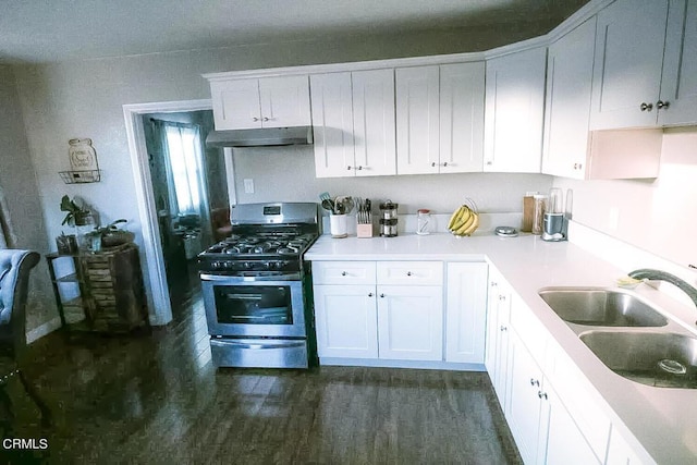 kitchen with sink, white cabinets, and stainless steel gas range