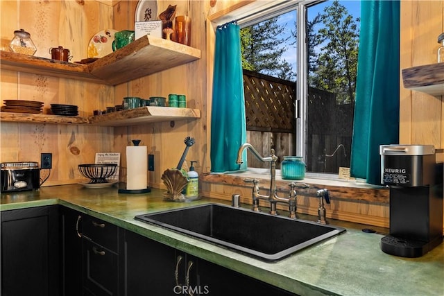 17040 Edgewood Way, Cobb, CA 95461 - kitchen featuring a sink, open shelves, dark cabinets, wooden walls, and stainless steel counters