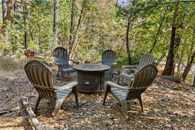 17040 Edgewood Way, Cobb, CA 95461 - view of patio / terrace with an outdoor fire pit