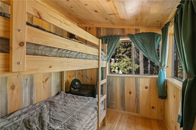 17040 Edgewood Way, Cobb, CA 95461 - bedroom with wood walls, multiple windows, wood ceiling, and wood-type flooring
