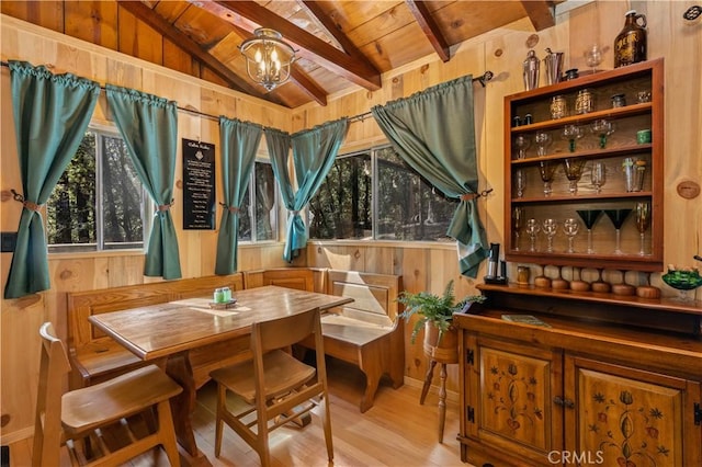 17040 Edgewood Way, Cobb, CA 95461 - dining room featuring wood ceiling, wood finished floors, a chandelier, and wood walls