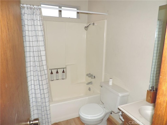 full bathroom with shower / tub combo with curtain, vanity, and toilet