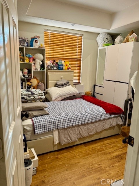 bedroom with light wood-type flooring