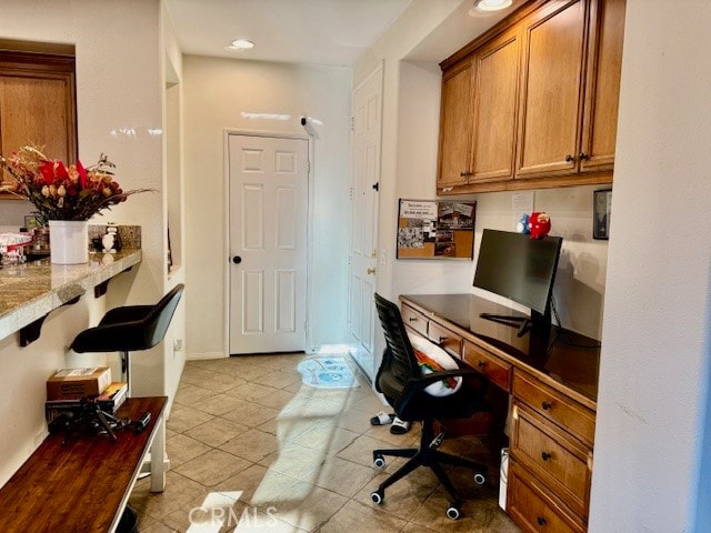 office area with light tile patterned flooring