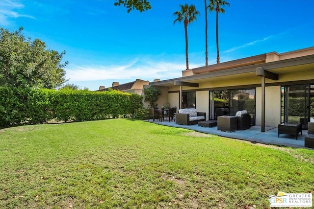 view of yard with outdoor lounge area and a patio area