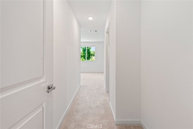 corridor with light colored carpet