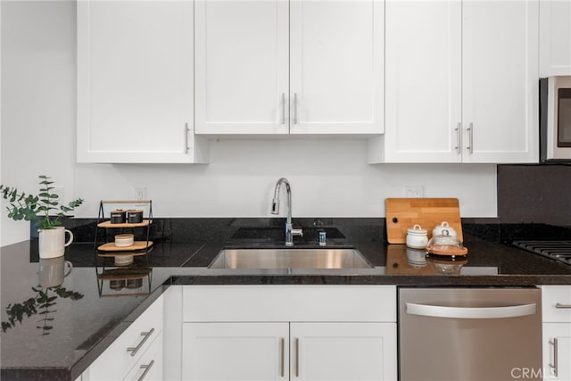 kitchen featuring white cabinetry, sink, and appliances with stainless steel finishes