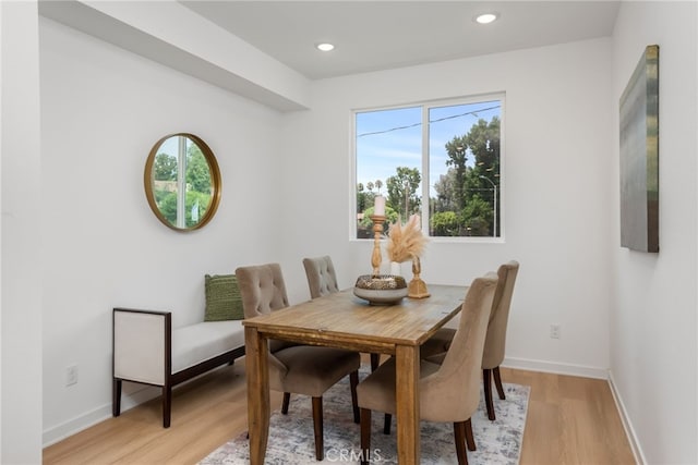 dining area featuring light wood-type flooring and a wealth of natural light