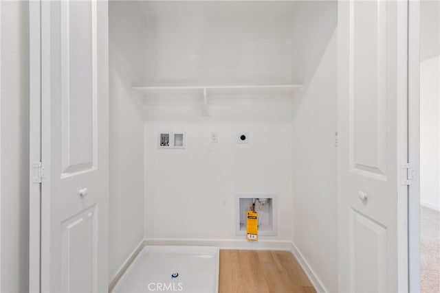 laundry room with hookup for an electric dryer, hookup for a washing machine, and light hardwood / wood-style flooring