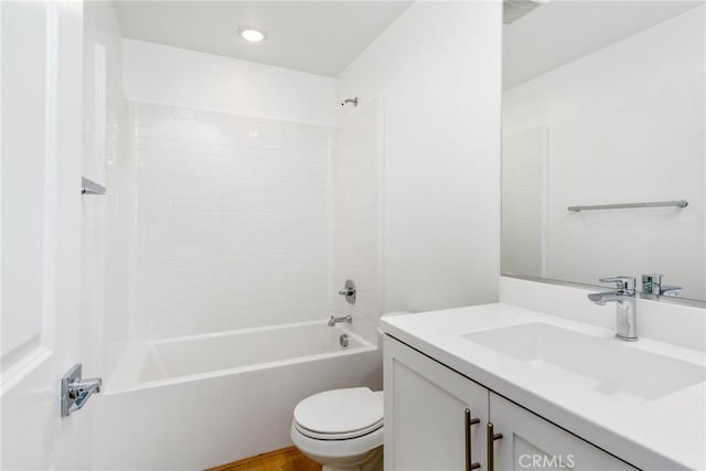 full bathroom with vanity, hardwood / wood-style floors,  shower combination, and toilet