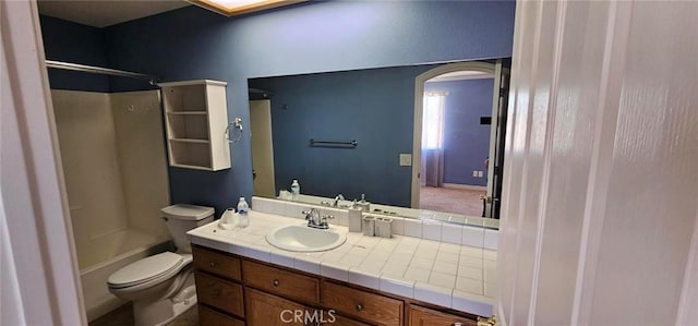 bathroom with toilet, bathtub / shower combination, and vanity