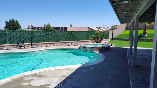 view of pool with a patio, a fenced backyard, and a pool with connected hot tub