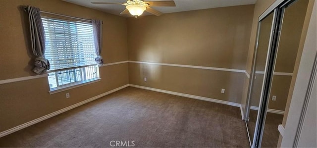 unfurnished bedroom featuring a closet, baseboards, a ceiling fan, and carpet flooring