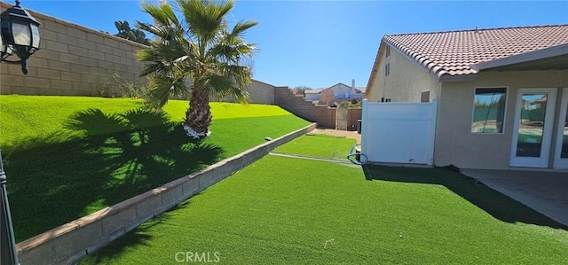 view of yard with a fenced backyard