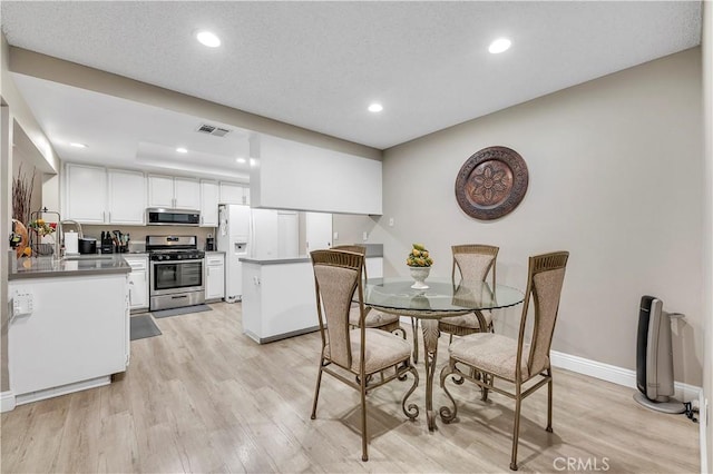 1186 Bottle Tree Way, Hemet, CA 92545 - dining space featuring light wood finished floors and recessed lighting