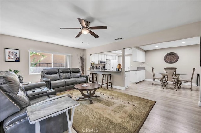 1186 Bottle Tree Way, Hemet, CA 92545 - living area featuring a ceiling fan, light wood-style flooring, and recessed lighting