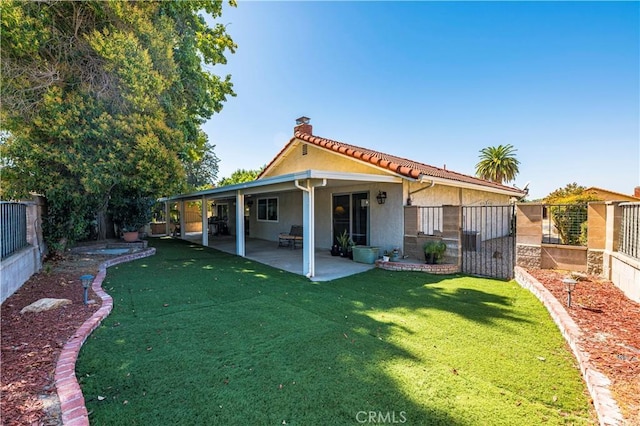 1186 Bottle Tree Way, Hemet, CA 92545 - rear view of property featuring a chimney, stucco siding, a fenced backyard, a patio, and a tile roof