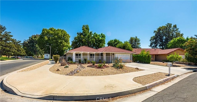 ranch-style home featuring a garage