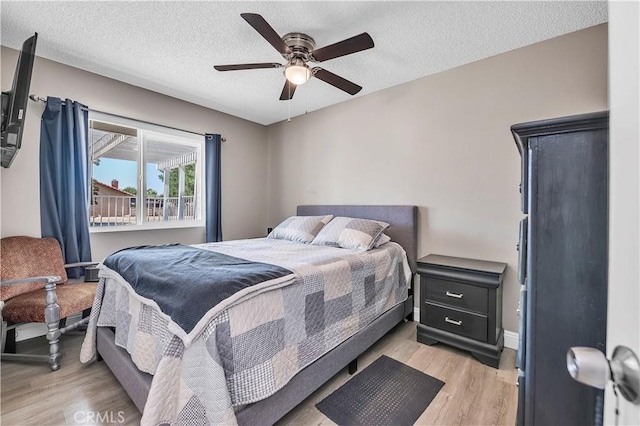 1186 Bottle Tree Way, Hemet, CA 92545 - bedroom with light wood-style floors, a textured ceiling, and ceiling fan