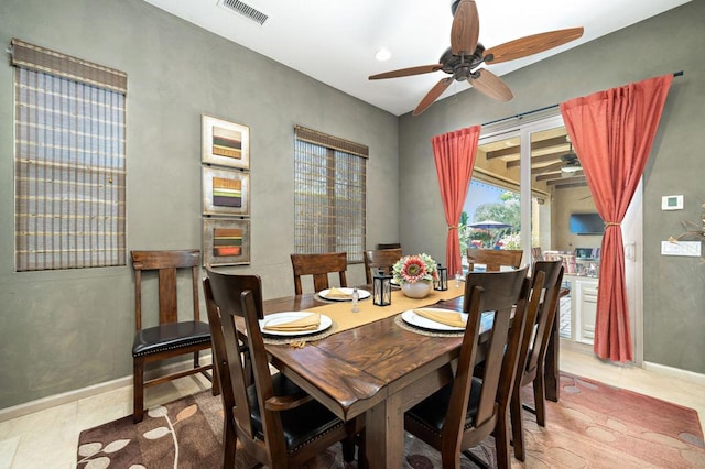 dining space with ceiling fan