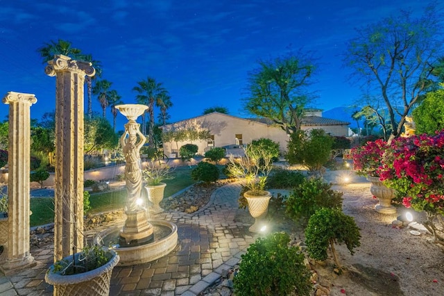 view of yard at twilight