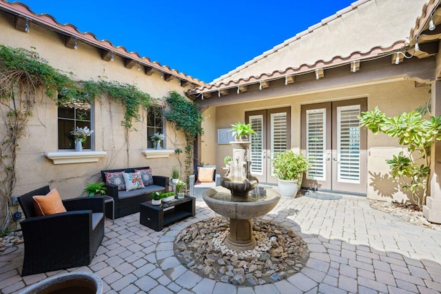 view of patio featuring french doors and an outdoor living space